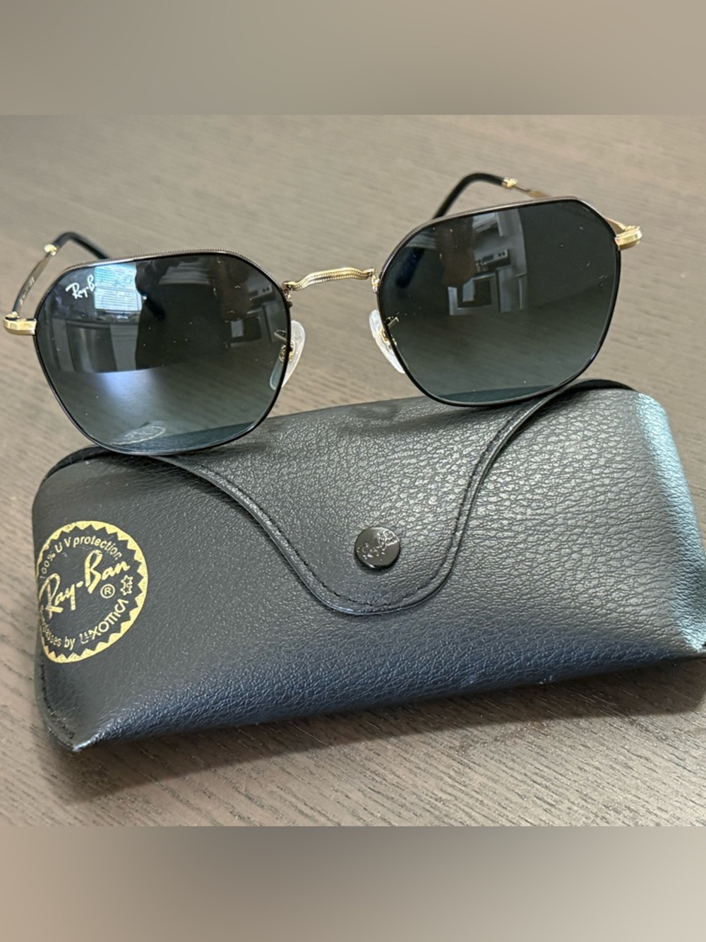 Ray-Ban Sunglasses with Black Lenses and Gold Frame